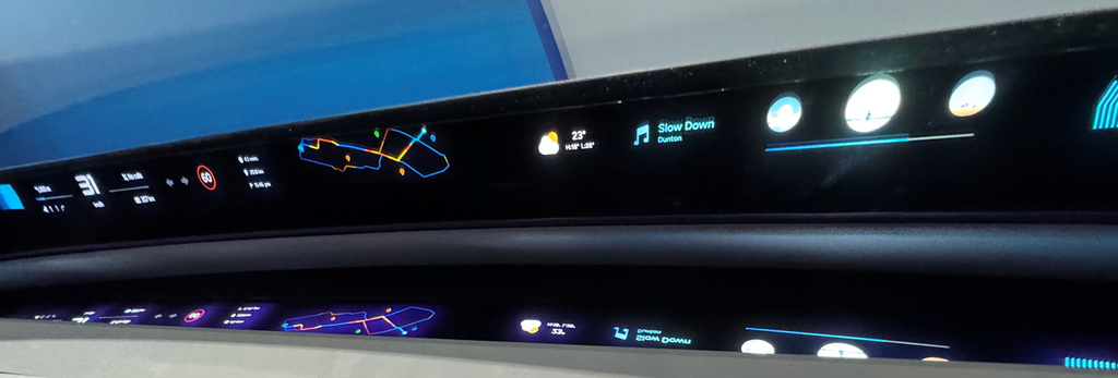 An electronic dashboard inside of a car.